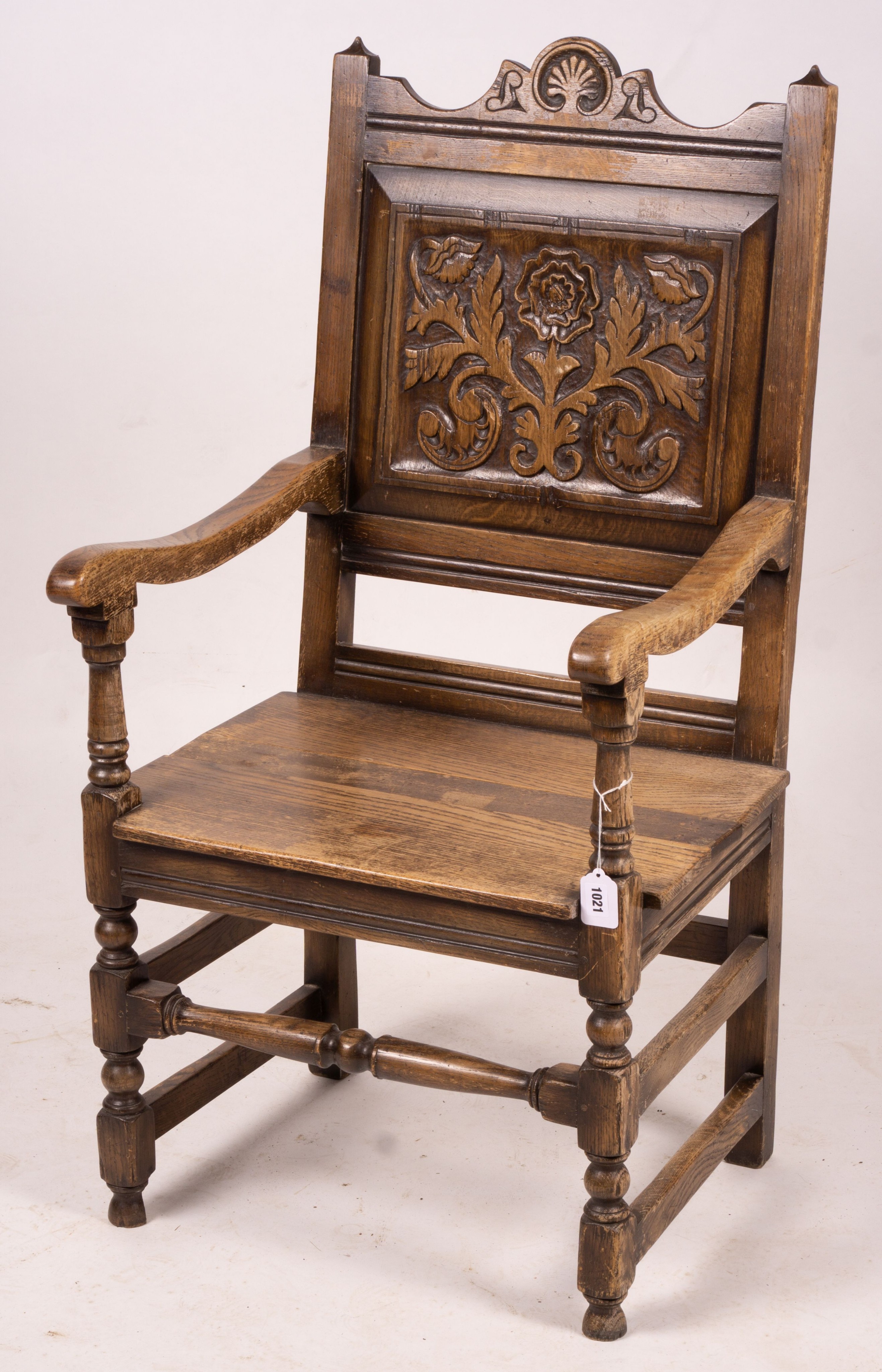 An early 20th century carved oak wainscot chair